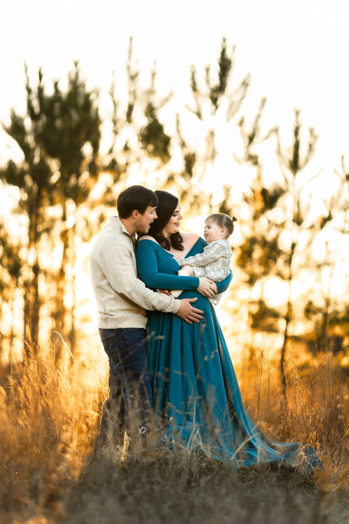 This maternity photo session was done in Trussville, AL. The shoot was done in an open field at sunset, and while the weather was cold, we got some great shots! 